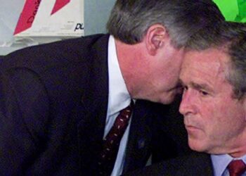President George W. Bush reacts in a Sarasota, Fla., classroom after being told of the terrorist attacks in New York and Washington on Sept. 11, 2001. AP Photo/Doug Mills